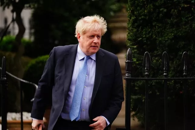 Boris Johnson leaving his London home