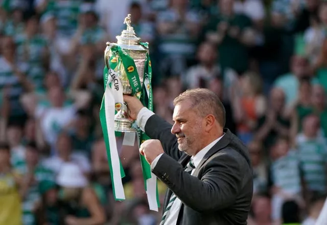 Celtic manager Angelos Postecoglou celebrates with the Scottish Cup trophy