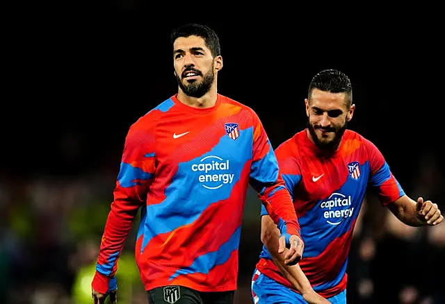 Luis Suarez warms up prior to the UEFA Champions League round of sixteen second leg match at Old Trafford, Manchester