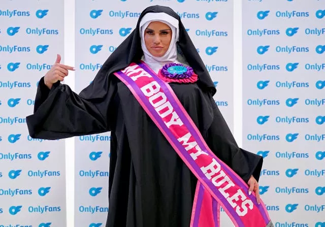 Katie Price dressed as a nun wearing a sash saying 'My Body My Rules'