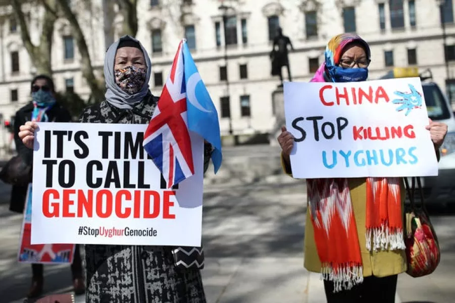 Uyghurs during a demonstration in Parliament Square, London, in April 2021