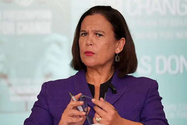 Head and shoulders photo of Mary Lou McDonald in purple suit jacket