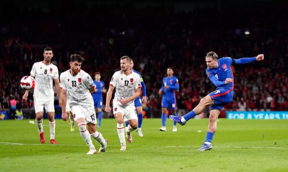 England's Jack Grealish (right) shoots