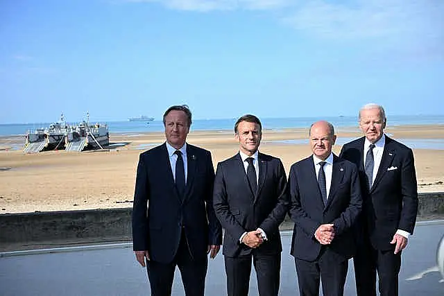 World leaders including Joe Biden appear with Lord Cameron in Normandy