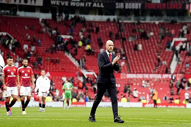 Manchester United manager Erik ten Hag applauds in front of a largely empty stand at Old Trafford following this season's 3-0 defeat to Liverpool