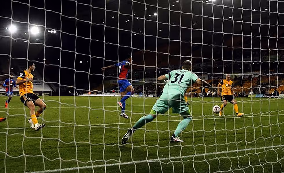 Daniel Podence, right, scores Wolves' second goal
