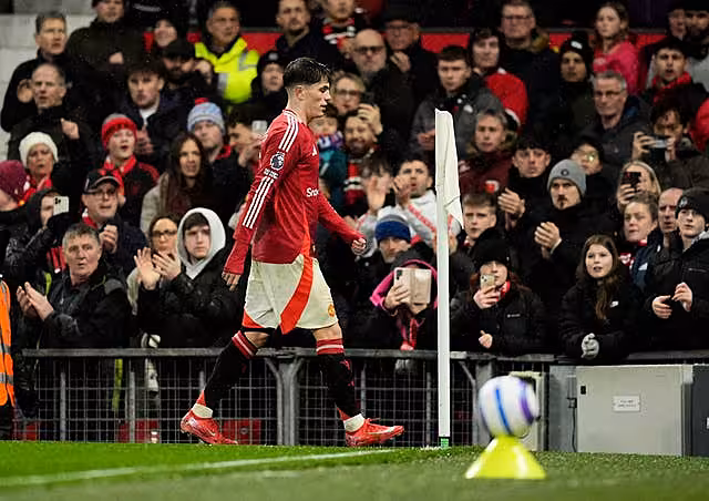 Garnacho walks towards the tunnel after being substituted in United's win over Ipswich (Martin Rickett/PA)