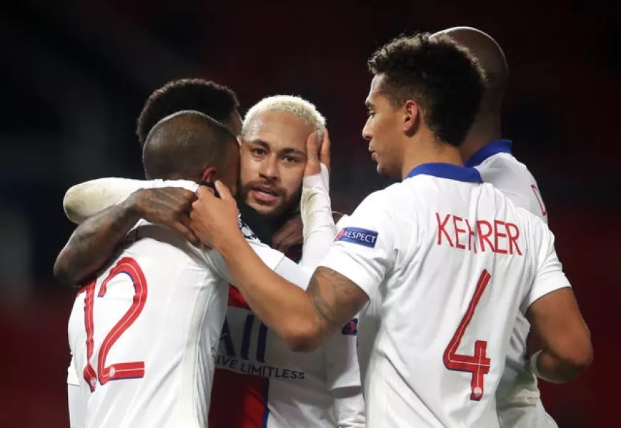 Paris Saint Germain’s Neymar celebrates with his team-mates after scoring the third goal at at Old Trafford