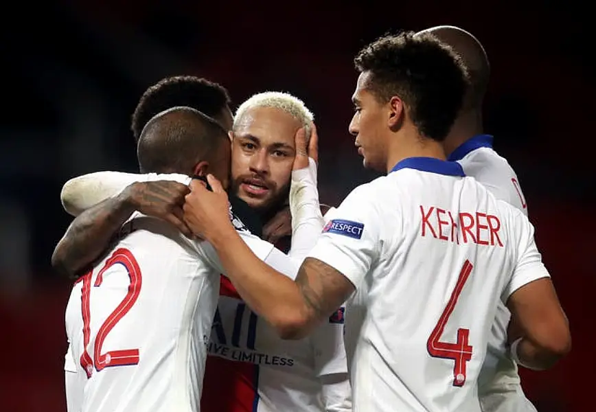 Paris Saint Germain’s Neymar celebrates with his team-mates after scoring the third goal at at Old Trafford