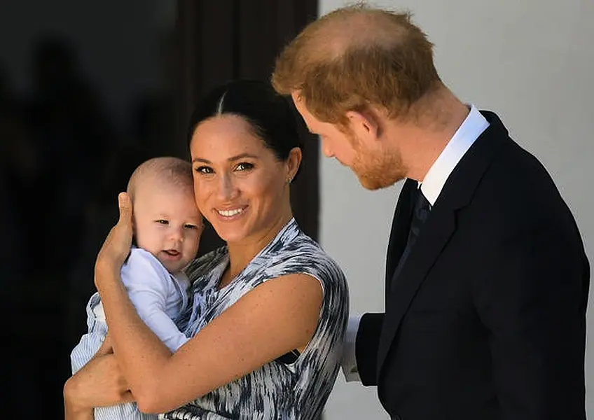 The Duchess of Sussex with her son Archie and husband Harry