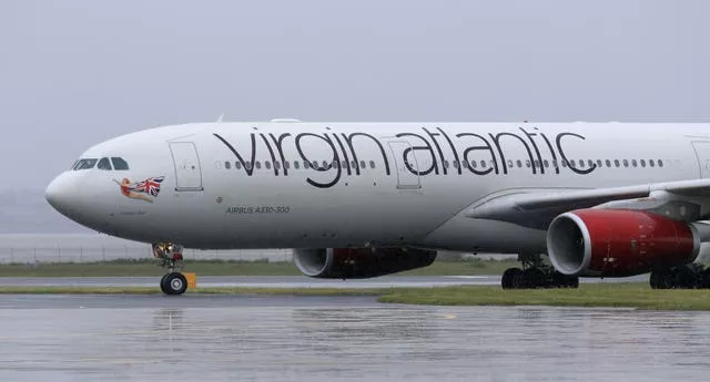 Virgin plane turns back