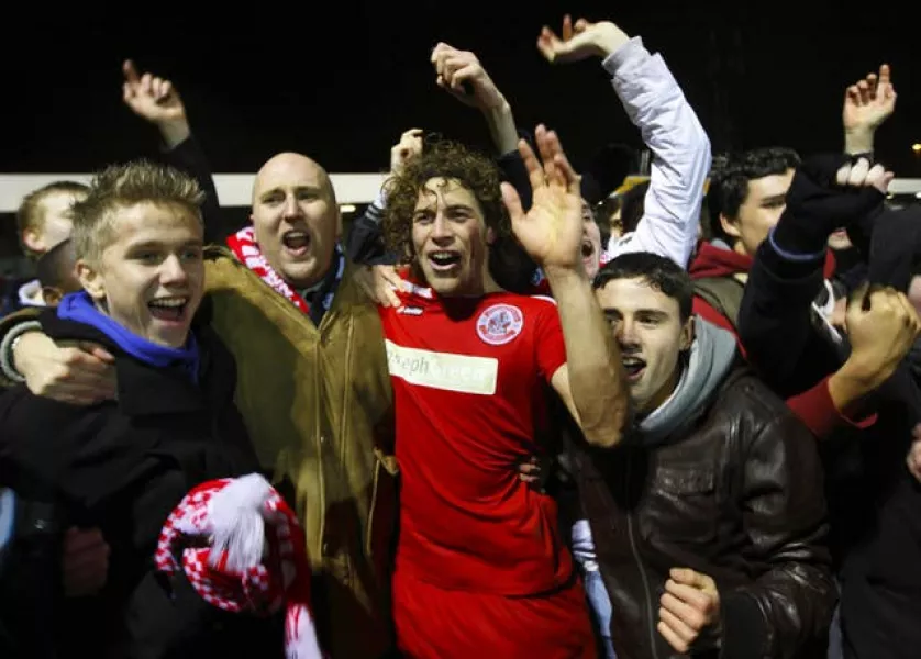 Crawley match-winner Sergio Torres celebrates with fans after scoring against Derby in the FA Cup third round