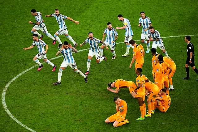 Argentina players celebrate after winning the penalty shootout