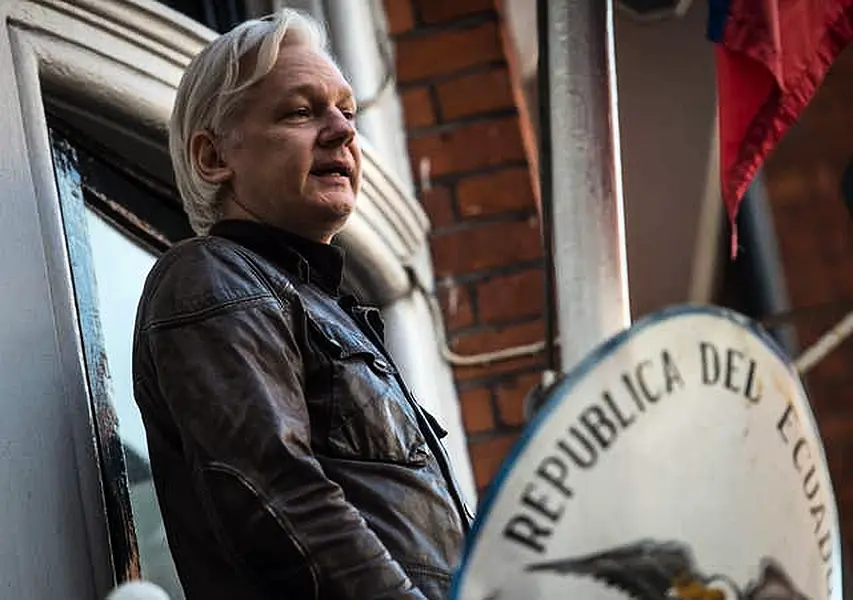 Julian Assange speaks from the balcony of the Ecuadorian embassy