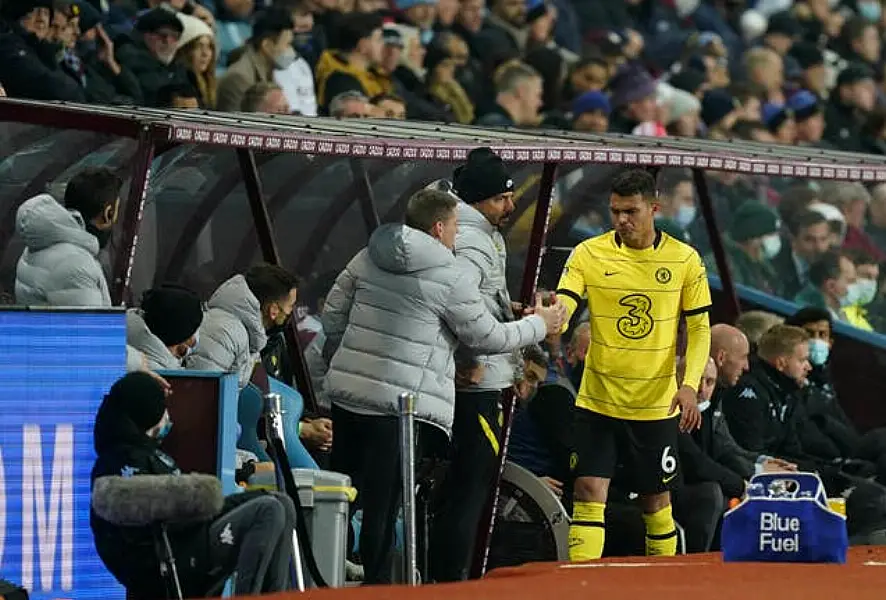 Thiago Silva is consoled by members of the Chelsea back room staff after being forced to come off with an injury against Aston Villa