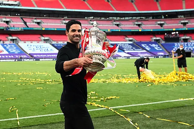 Arsenal boss Mikel Arteta holds the FA Cup after Arsenal's victory in 2020