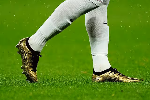 Close-up view of Harry Kane's gold boots to mark his 100th England cap
