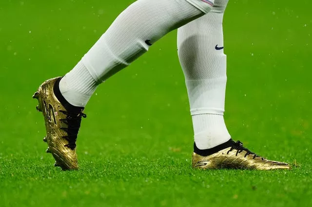 Close-up view of Harry Kane's gold boots to mark his 100th England cap