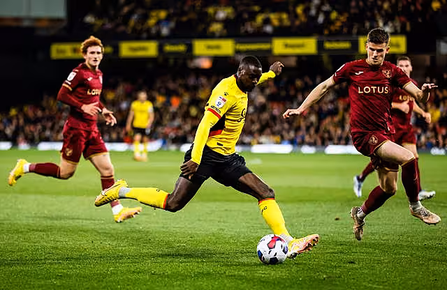 Watford's Ken Sema looks to cross the ball under pressure from the Norwich defence