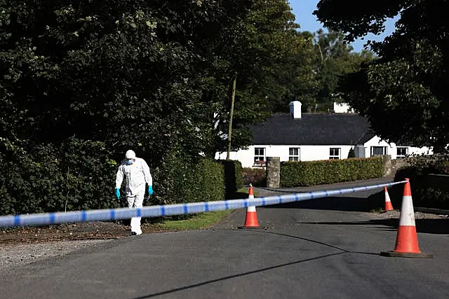 A police forensic officer at the scene following a shooting in the Ballsmill Road area of Crossmaglen