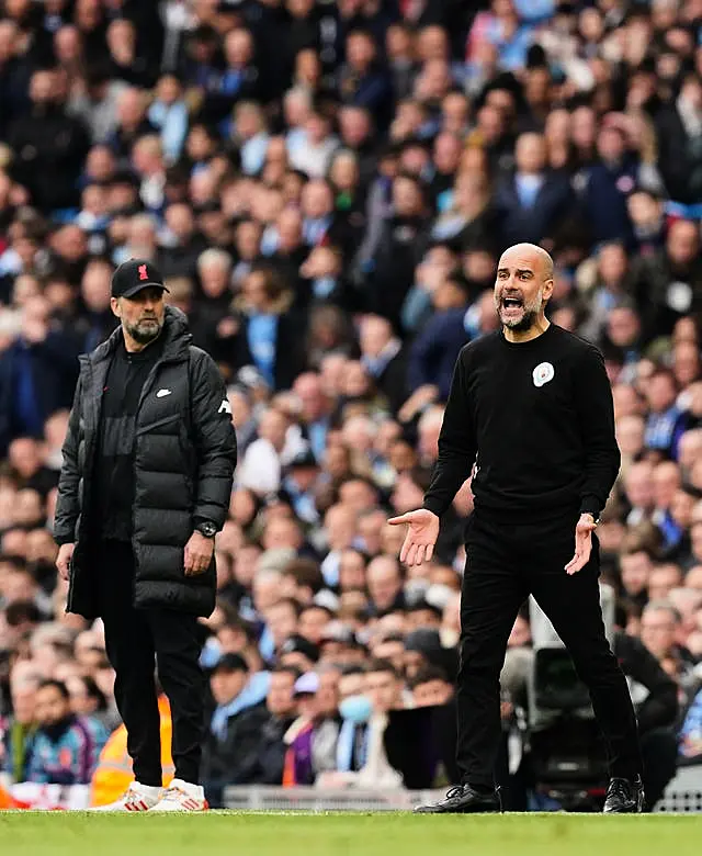 Guardiola (right) understands Liverpool boss Jurgen Klopp's (left) frustrations with the schedule