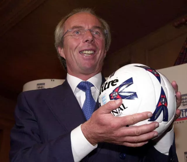 Sven-Goran Eriksson holds a football