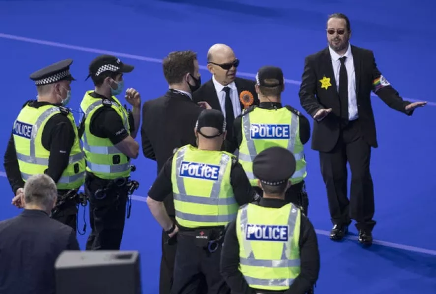 Scottish Liberal Party members being spoken to by police