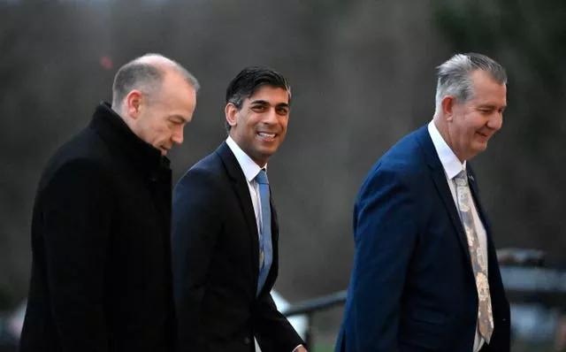 Prime Minister Rishi Sunak, centre, with Northern Ireland Secretary Chris Heaton-Harris and newly appointed speaker of the Northern Ireland Assembly Edwin Poots arriving at Parliament Buildings at Stormont