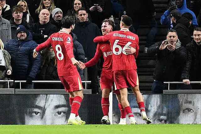 Liverpool’s Alexis Mac Allister (centre) celebrates scoring their second goal at Tottenham