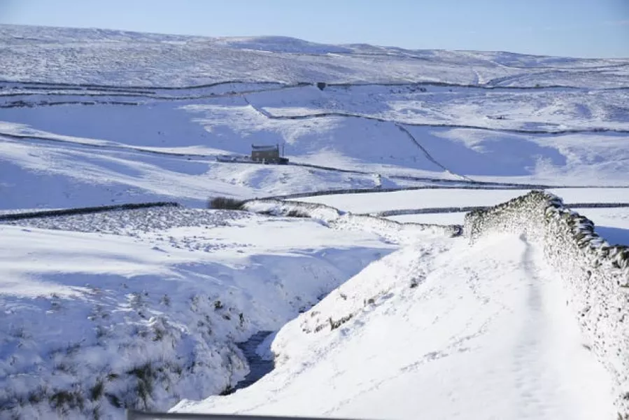 A cottage surrounded by snow-covered fields near Stainmore, in the Pennines