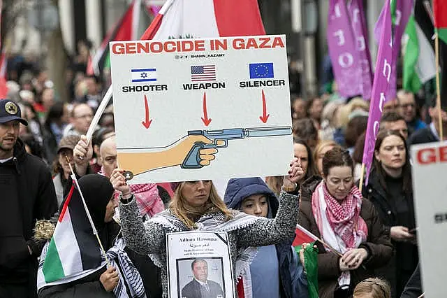 People march between the Garden of Remembrance and the Dail in Dublin