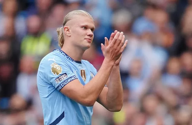 Erling Haaland applauds the fans as he leaves the pitch