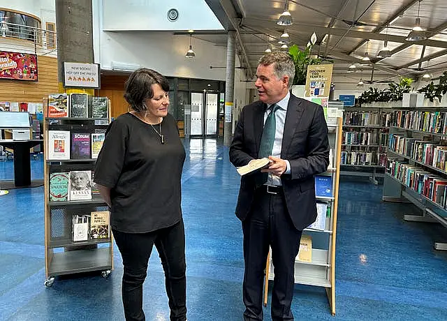 Senior librarian Clodagh Kingston speaks to Minister for Public Expenditure Paschal Donohoe at Cabra Library in Dublin 