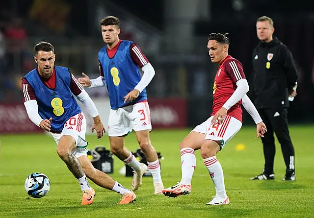 Aaron Ramsey, left, started for Wales