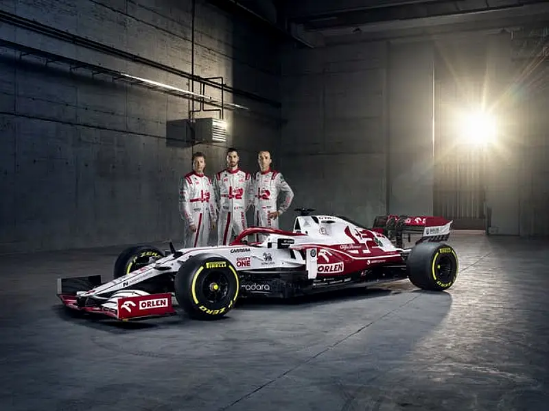 Alfa Romeo drivers Kimi Raikkonen (left) and Antonio Giovinazzi (centre) 