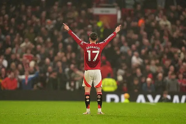 Manchester United’s Alejandro Garnacho celebrates with arms raised after scoring 