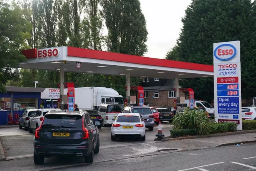 Drivers queue for fuel at an Esso petrol station in Bournville, Birmingham
