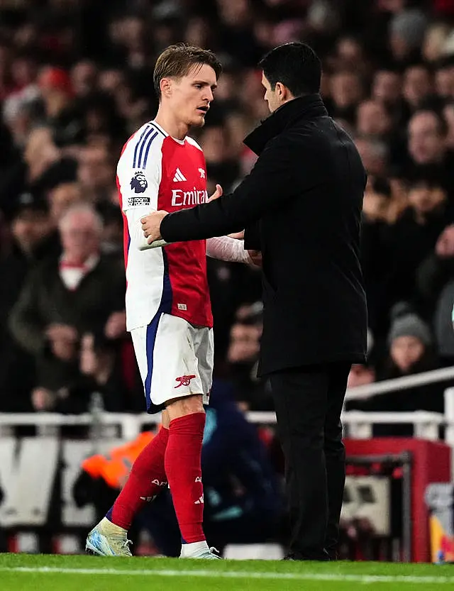 Mikel Arteta greets Martin Odegaard