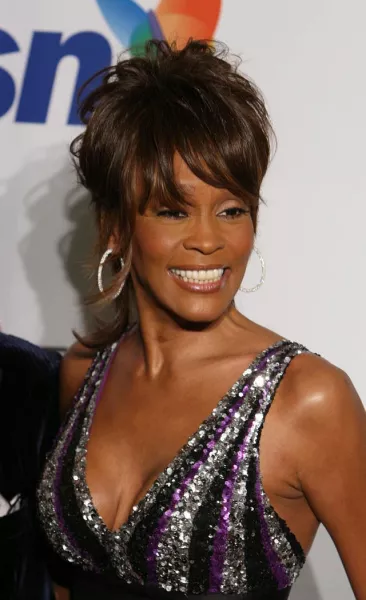 Whitney Houston arrives at an awards ceremony 