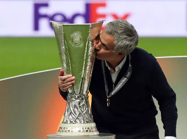 Jose Mourinho kisses the Europa League trophy