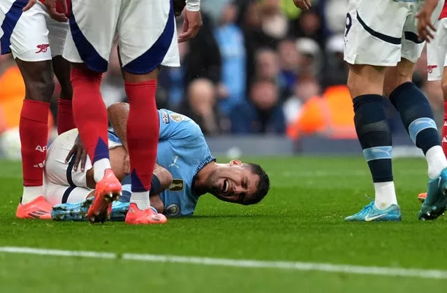 Manchester City’s Rodri lies injured against Arsenal