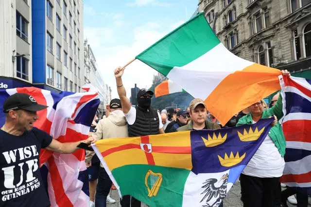 Protesters wave flags