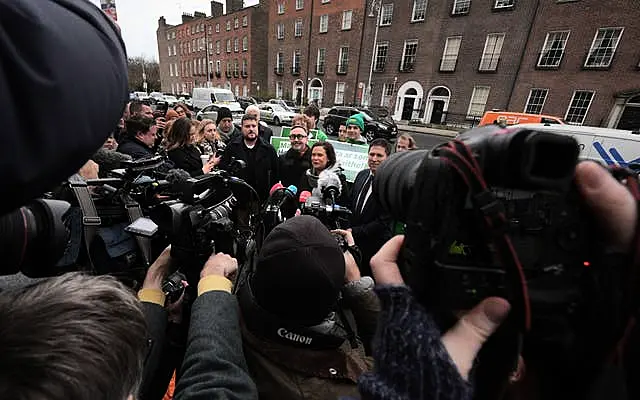 Sinn Fein leader Mary Lou McDonald speaking to the media with candidates Eoin O Broin (centre left), Matt Carthy (centre right) and supporters outside Government Buildings, Dublin