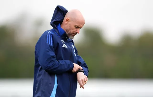 Manchester United boss Erik ten Hag checks his watch during a training session