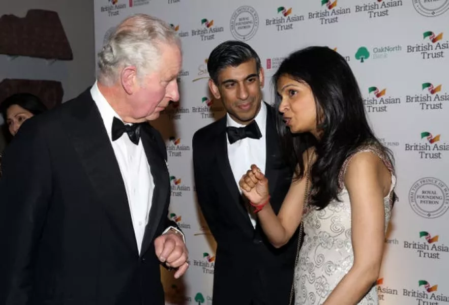 The Prince of Wales speaks to Chancellor Rishi Sunak and Akshata Murthy