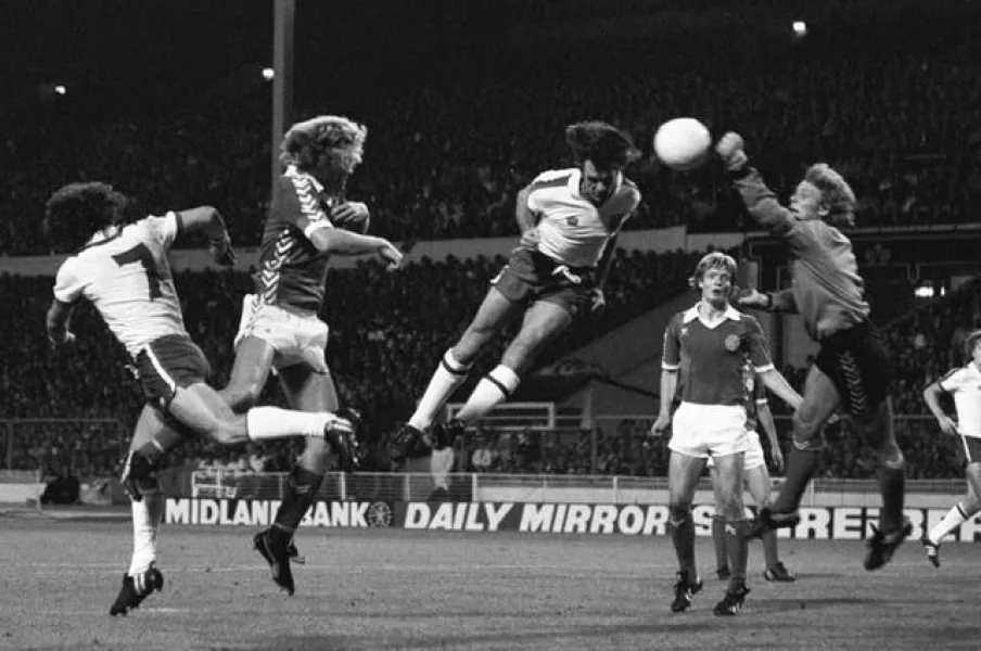 Dave Watson going for a header while playing for England