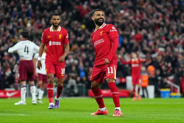 Mohamed Salah celebrates Liverpool's third goal of the evening