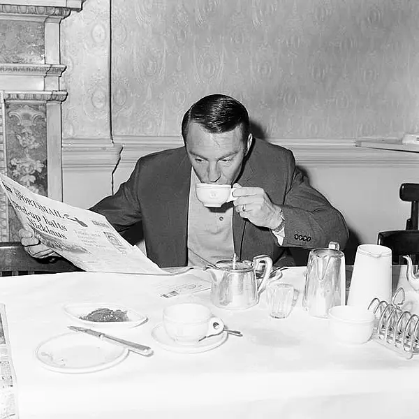 Jimmy Greaves reads a newspaper at the England team hotel during the 1966 World Cup