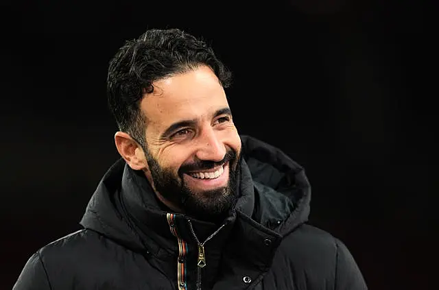 Manchester United manager Ruben Amorim smiles