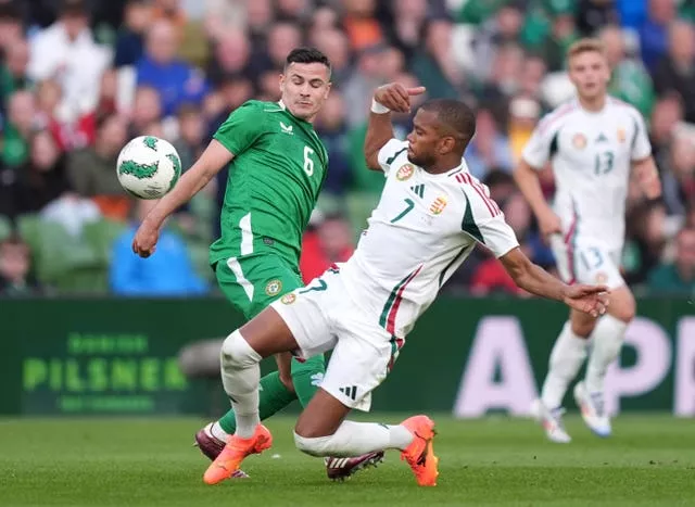 Republic of Ireland midfielder Josh Cullen and Hungary’s Loic Nego battle for the ball